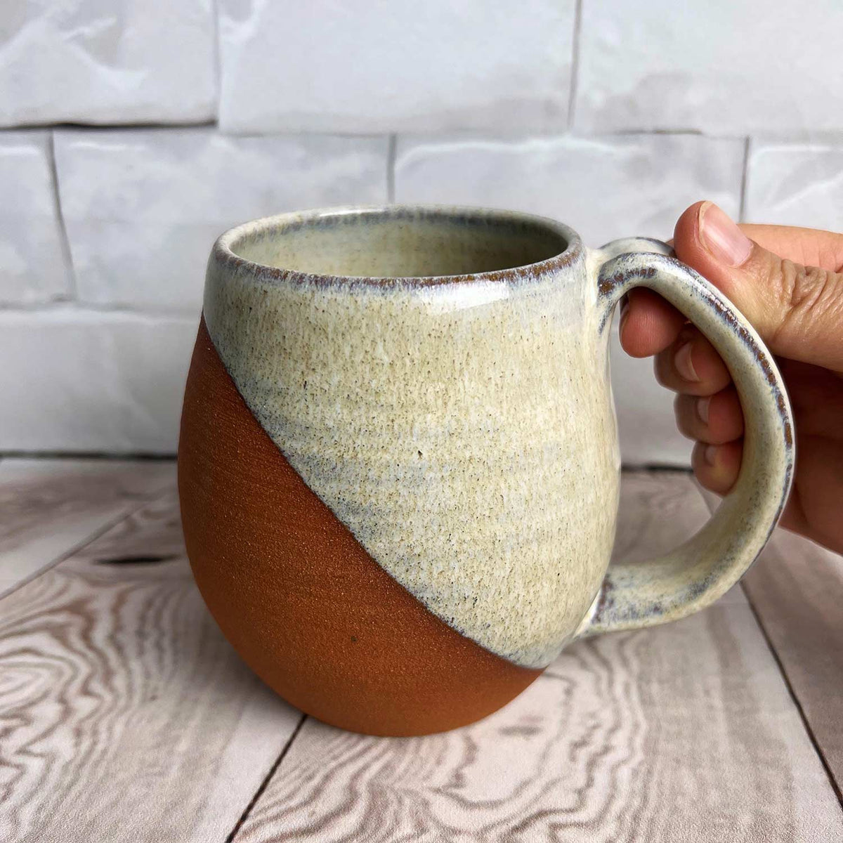 http://madeinwashington.com/cdn/shop/products/3-09128-Fern-Street-Pottery-Angle-Dipped-Speckled-White-Mug_1200x1200.jpg?v=1664923168