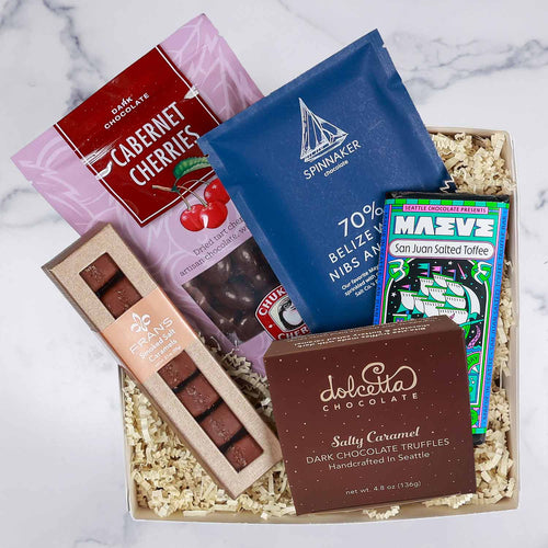 An assortment of locally made chocolate confections on a white background | Gourmet Chocolate Gifts| Chocolate Tasting Flight | Made In Washington | Washington Gift Ideas | Artisan Chocolate Gift Basket