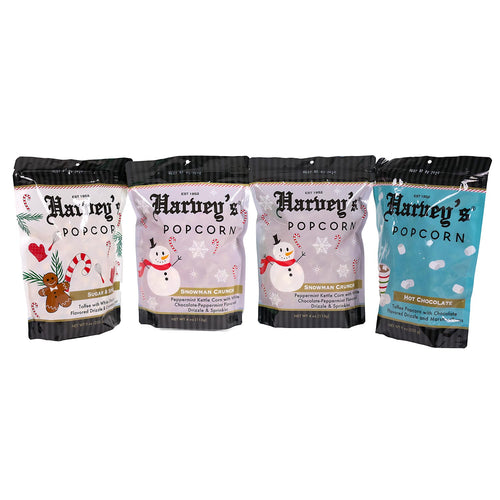 Four bags of Harveys Popcorn with different flavors on a white background | Harvey's Popcorn Holiday Gift Pack | Made In Washington | Christmas Popcorn | Holiday Flavors