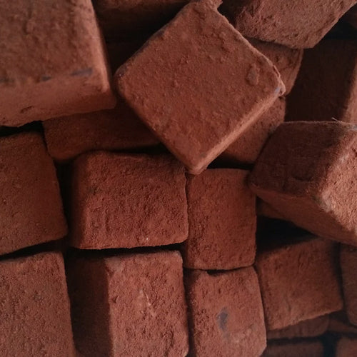 Brown box of chocolate truffles on a white background | Dolcetta Salty Caramel Dark Chocolate Truffles | Made In Washington | Treats For Your Sweet Tooth