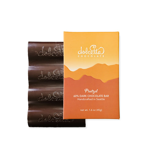 Dolcetta Chocolate Pretzel 60% Dark Chocolate Bar packaging on a white background | Dolcetta Dark Chocolate Pretzel Bar | Made In Washington | Candy Bar Lover Gifts