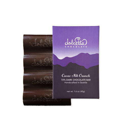 Dolceita Cacao Nib Crunch chocolate bar with packaging on a white background  |  Dolcetta Artisan Sweets | Made In Washington | Locally Made Chocolate Candy Bars