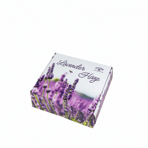 Moving image of the gift box Lavender Haze gift box opening to  show the products inside and then closing on a white background.