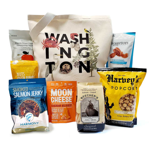 Assorted snack packages including salmon jerky, moon cheese, and popcorn with a tote bag labeled 'Washington'. 