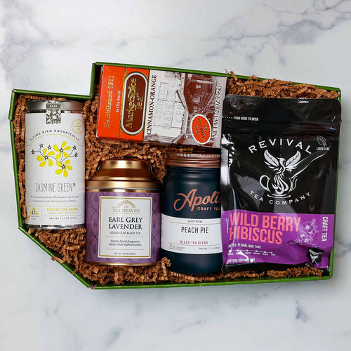 Collection of tea products including tins and boxes with a Washington Shaped Box by Made in Washington | Teas Across Washington State Gift Box | Made In Washington | PNW Gift Box | Local PNW Gift Baskets