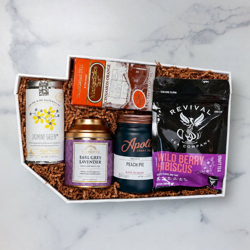Teas Across Washington gift set with five artisan teas displayed in front of a green Washington-shaped box.