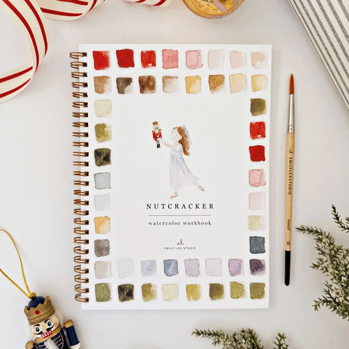 Watercolor workbook titled 'Nutcracker' with a decorative cover on a white surface | Emily Lex Nutcracker | Made In Washington Watercolor Workbook | Artist Gifts