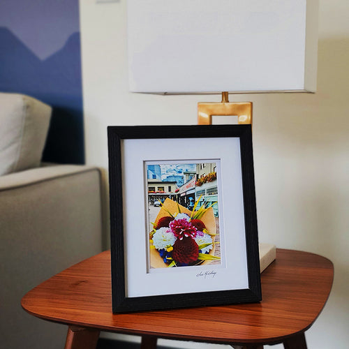 Framed photograph of a street scene with a bouquet of flowers in the foreground | Jax Kaufman Photography | Made In Washington | Wall Art Gifts