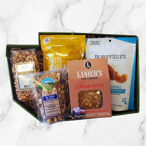Assorted packaged snacks and candies with visible brand labels on a white background | Nuts About Washington State | Made In Washington | Local Gift Baskets