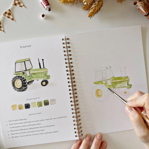 Color swatch workbook titled 'Farm' with a toy horse, cow, and paintbrush on a white surface. | Emily Lex Studio Farm Watercolor Workbook | Made In Washington | Gifts For Beginning Artists