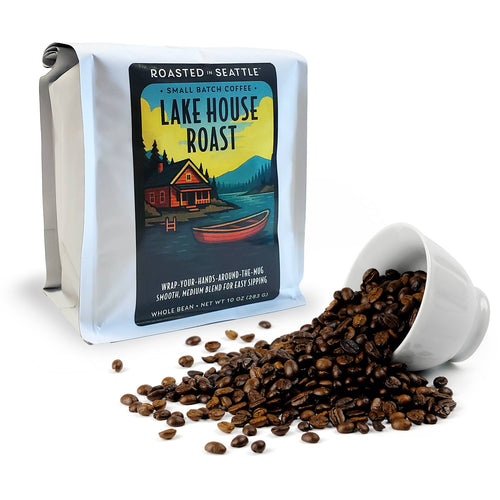 Coffee bag with 'Lake House Roast' label featuring a cabin and lake design. | Roasted In Seattle Lake House Roast Whole Bean Coffee | Made In Washington | Coffee Gifts From the PNW