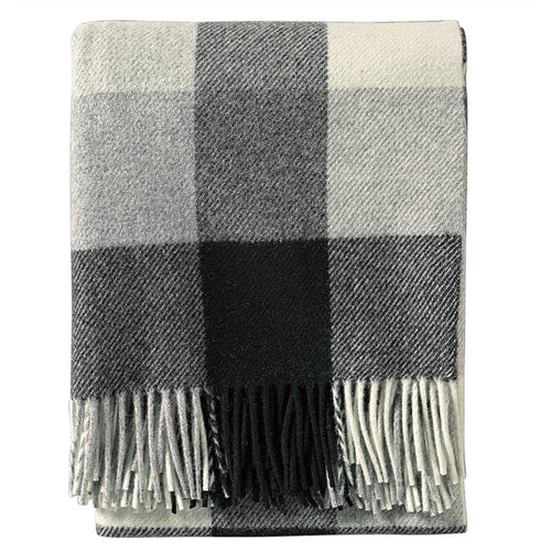 Gray and white checkered throw blanket with fringes on a white  background  Pendleton PNW Eco Wise Washable Throw Black Ivory | Made In Washington | Cozy Gifts From Washougal