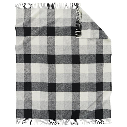Gray and white checkered throw blanket with fringes on a white  background  Pendleton PNW Eco Wise Washable Throw Black Ivory | Made In Washington | Cozy Gifts From Washougal