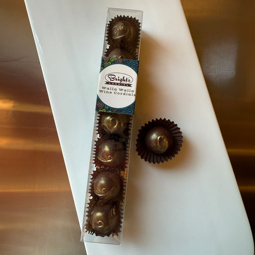 Box of chocolate truffles with Bright's Candies of Walla Walla brand label on a white surface. | Bright's Candies Walla Walla Wine Cordials | Made In Washington | PNW Chocolate Gifts