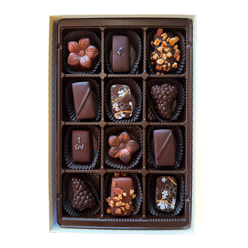 Box of chocolates with a brown ribbon and Bright's Candies logo on a white background | Bright's Candies Specialty Chocolate Box Assortment | Made In Washington | Local Chocolate Candies