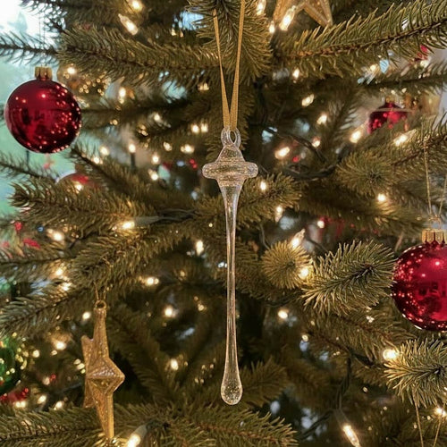 Glass Iconic Needle landmark pendant with a tag on a white background | Seattle Holiday Ornament | Made In Washington | Robert Bank Glass | Space Needle Ornament