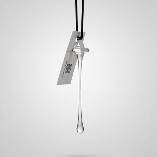 Glass Iconic Needle landmark pendant with a tag on a white background | Seattle Holiday Ornament | Made In Washington | Robert Bank Glass | Space Needle Ornament