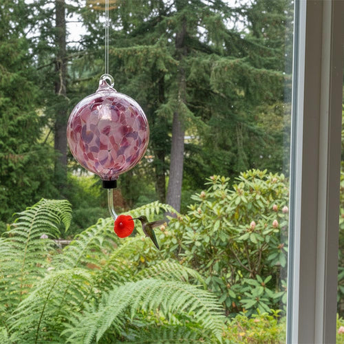 Decorative blown glass hummingbird feeder with pink and purple mosaic design on a white background | Glass Eye Studio | Buy Locally Made Hummingbird Feeders at Made In Washington Gift Stores