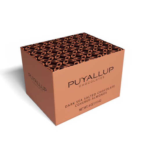 Chocolate-covered almonds on a white background | Puyallup Chocolates locally made chocolate treats at Made In Washington gift stores