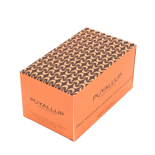 Two milk chocolate-covered fortune cookies on a white background | Shop for locally handcrafted treats at Made In Washington gift stores.