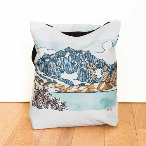 Summer in the Alpine tote bag featuring a mountain ridge and pink alpine wildflowers, designed by Port Angeles artist Amy Duffy