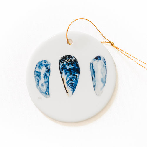 PNW decorative ornament with indigo mussels shells on a white background