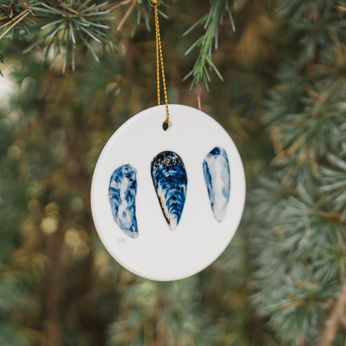 PNW decorative ornament with indigo mussels shells on a white background