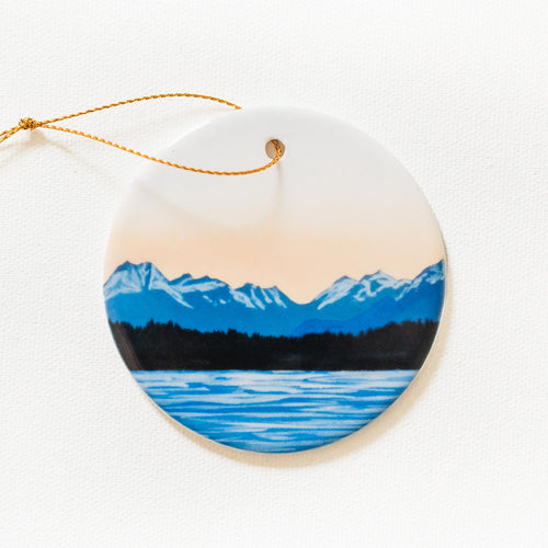 Summer on the Sound round ceramic ornament with mountain and pacific ocean design on a white background