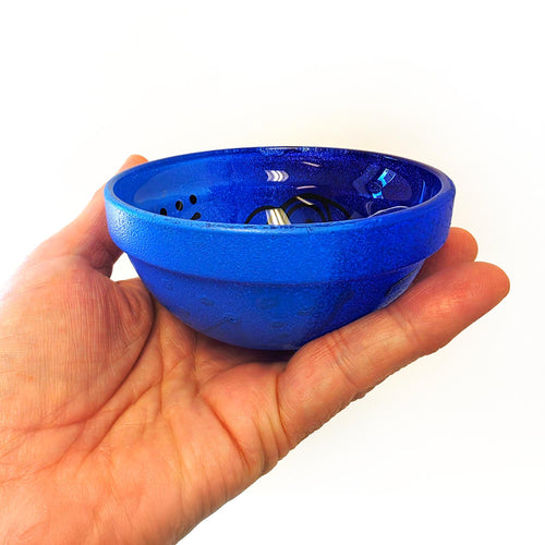 Blue reverse painted glass bowl with black abstract design on a white background