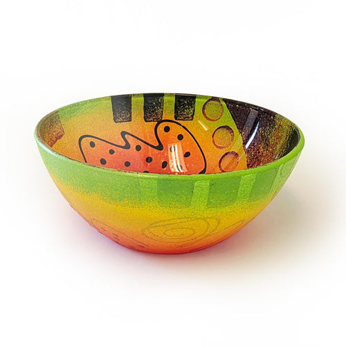 Colorful reverse painted Mardi Gras bowl with abstract design on a white background
