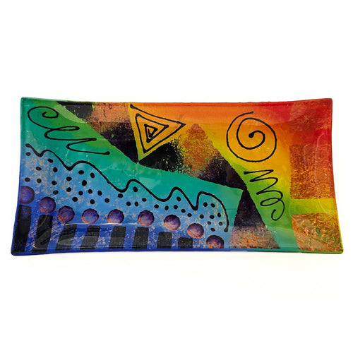 Colorful serving platter with abstract designs and geometric shapes on a white background