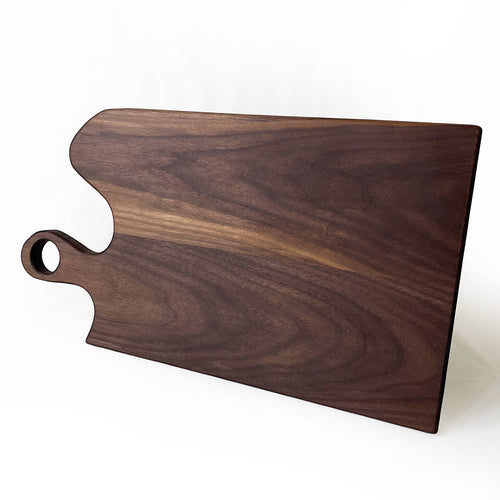 Wooden cutting board with a handle on a white background