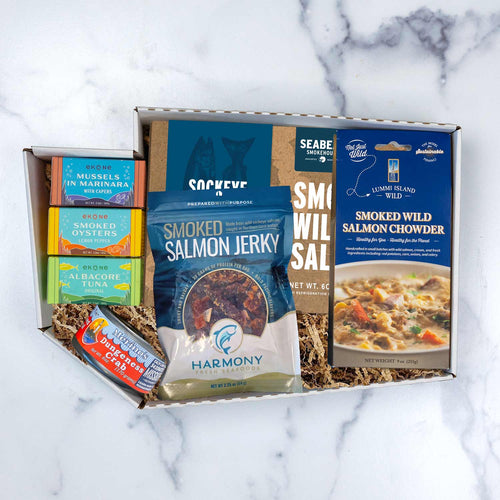 Captain's Catch gift set featuring SeaBear smoked salmon, salmon chowder, crab, and Ekone tinned seafood.