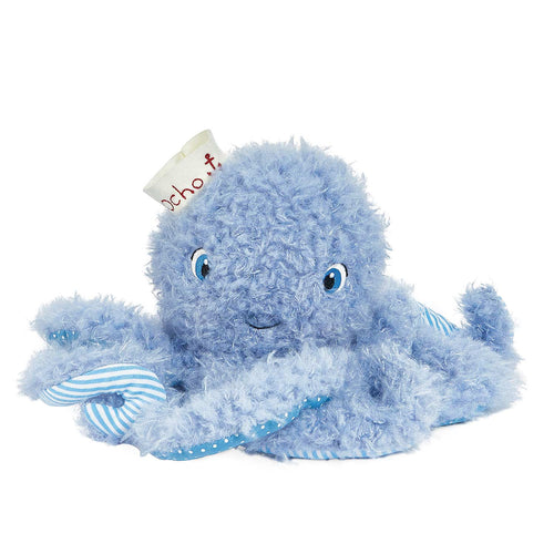 A light blue fluffy octopus plush toy with blue eyes, a small white paper tag attached, and blue-and-white striped accents on its arms, photographed on a plain white background.