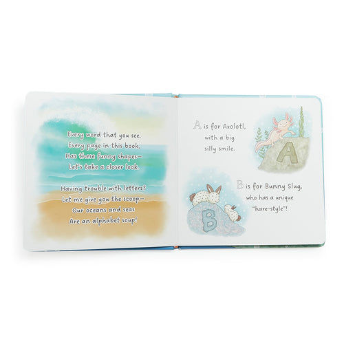 Bunnies By The Bay children's board book titled "ABC by the Sea: An Aquatic Alphabet Adventure" featuring a blue octopus holding red, orange, and green letters on a light blue water-themed cover.
