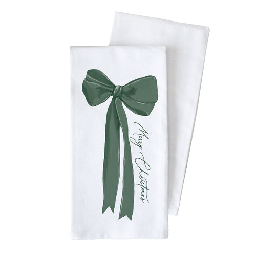 A white towel with a green bow and the words Merry Christmas  on a white background.
