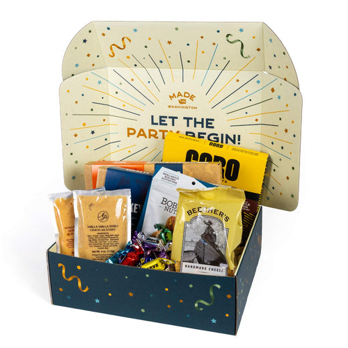 Gourmet Pacific Northwest gift basket arrangement with artisan snacks and sweets.
