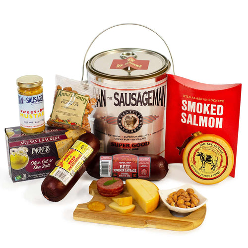 Assorted food products including a can of 'The Sausageman', smoked salmon, and cheese on a white background. | Made In Washington State Gift Baskets | Dan The Sausageman Paint Can