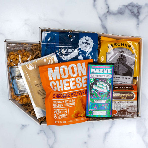 Bite Of Washington gift box packed with local snacks, SeaBear salmon, and Beecher's cheese.