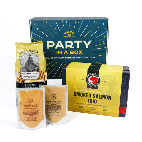 Party In A Box gift set with SeaBear Smoked Salmon Trio, Beecher's crackers, and AJ's mustard. on a white background