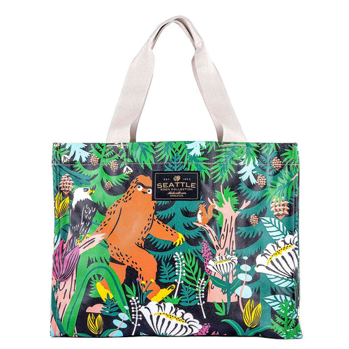 Chalo PNW Big Foot travel tote bag featuring an illustration of Sasquatch walking through a green forest.