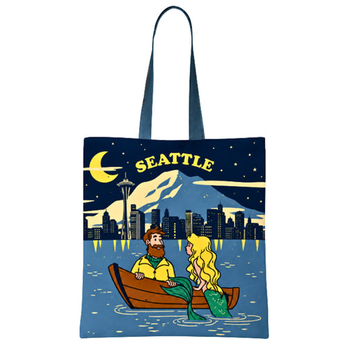 Chalo tote bag with Seattle skyline and cartoon characters of a mermaid and fisherman in a boat design.