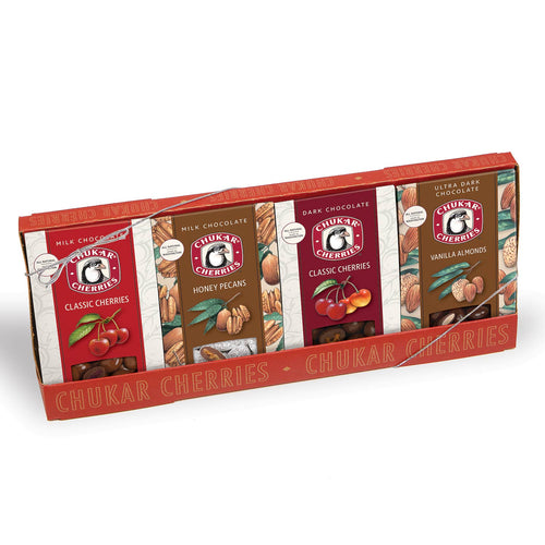 Box of Chukar Cherries chocolates in various flavors on a white background | Chukar Cherry Merry Quartet | Chocolate Gifts | Made In Washington Gifts | Local Chocolate Covered Cherries & Nuts
