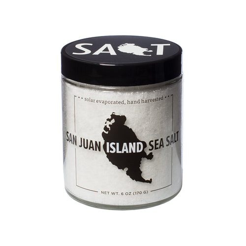 Jar of San Juan Island Sea Salt with black lid on a white background