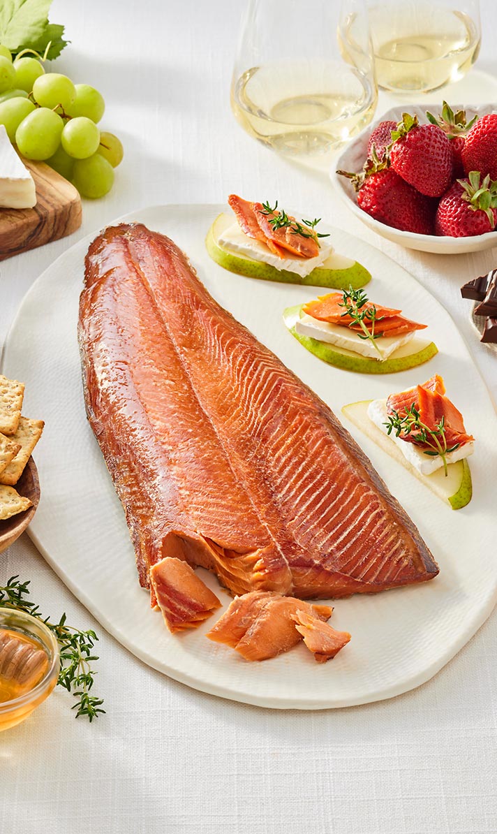 Platter of SeaBear smoked salmon with appetizers on a white tablecloth | Shop Local For Christmas | Made In Washington | Holiday Gifts