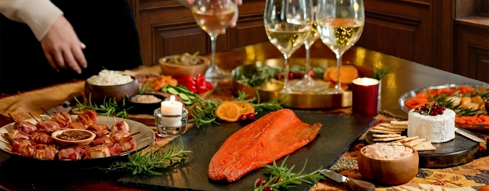 Dinner table set with smoked salmon, vegetables, and wine glasses in a cozy indoor setting. | Buy Local Gifts At Made In Washington